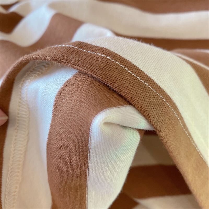 Striped sleeveless top and belted shorts set